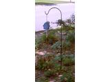 Birdhouse hung from a stick